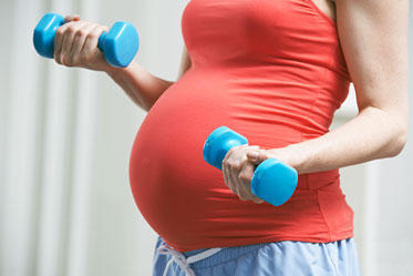 Pregnant Woman in Her Second Trimester Doing Exercising Lightly