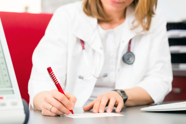 Gynecologist Writing Woman Prescription for Vaginal Discharge Concern