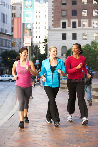 three-women-power-walking-exercise