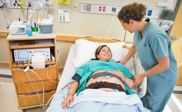 Woman Undergoing Non-Stress Test with Monitor Belt for Fetal Surveillance