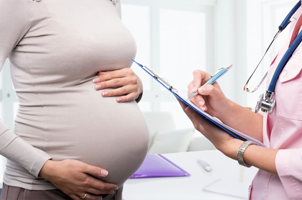 Obstetrician Consulting with Pregnant Patient