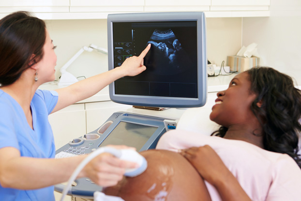 Pregnant Woman Getting Ultrasound During Prenatal Care